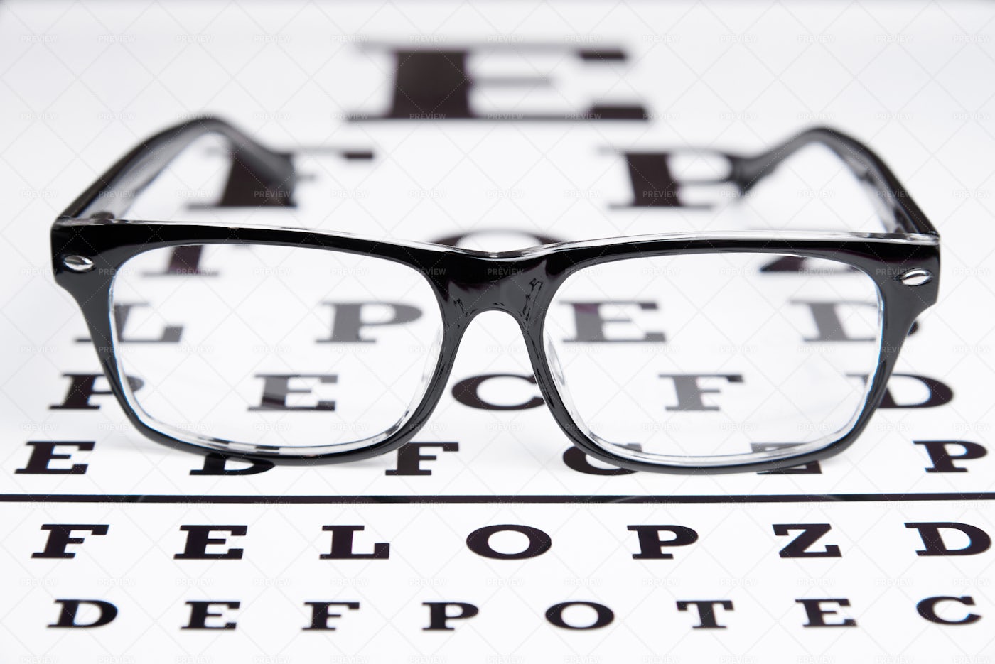 Glasses On Vision Test Chart: Stock Photos