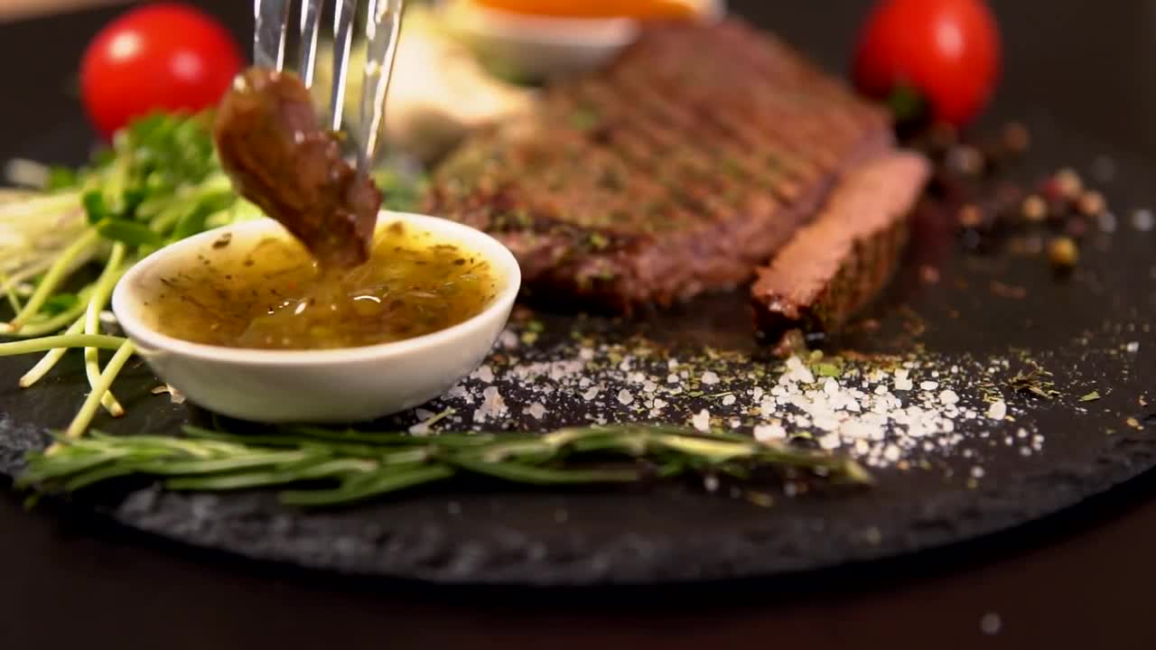 Dipping Beef Steak Into Sauce Stock Video Motion Array