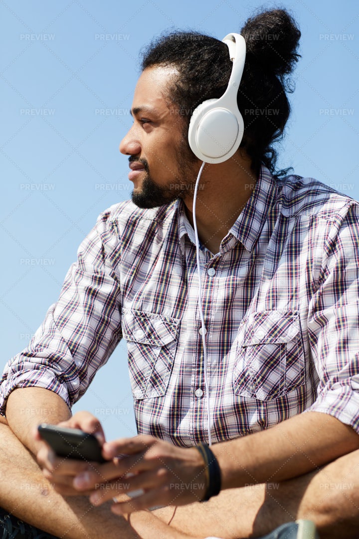 Contemporary Man Listening To Music...: Stock Photos