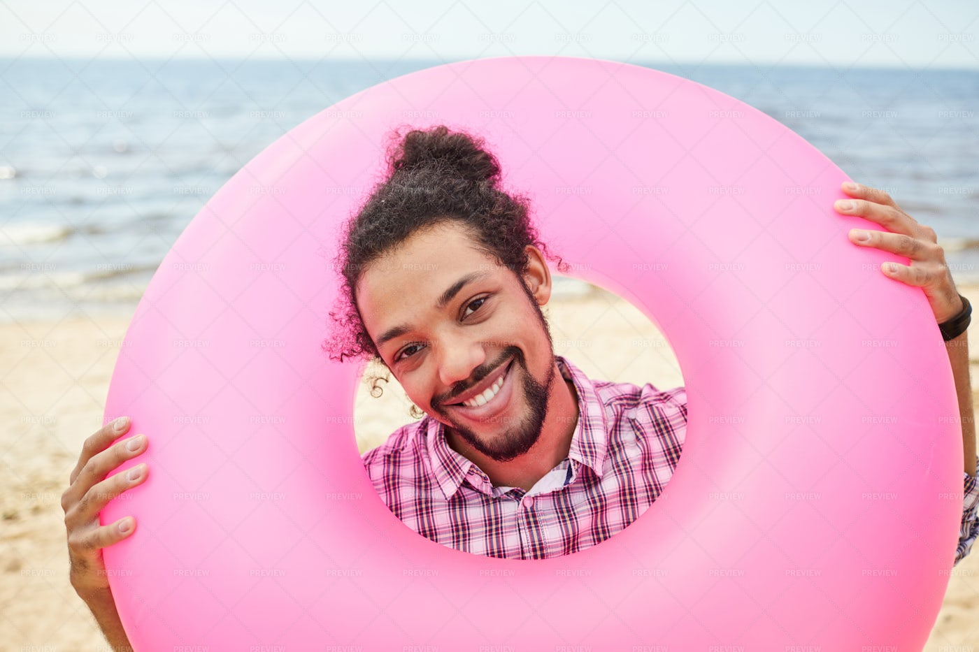 Mixed-Race Man Holding Swim Tube: Stock Photos