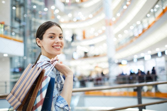 Positive Girl With Purchases - Stock Photos | Motion Array