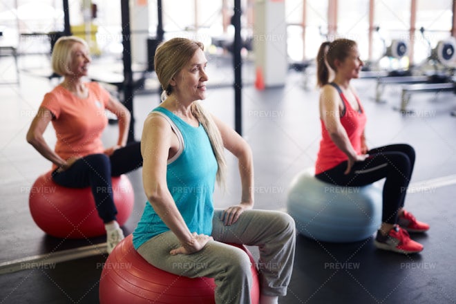 Full body woman in activewear holding leg on trapeze and doing splits while  exercising on cadillac machine in pilates studio Stock Photo - Alamy