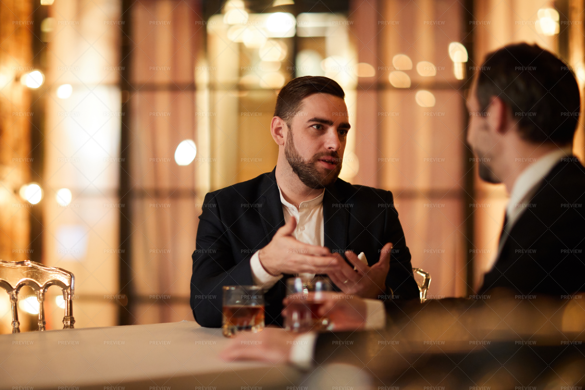 Two Business People Talking In... - Stock Photos | Motion Array