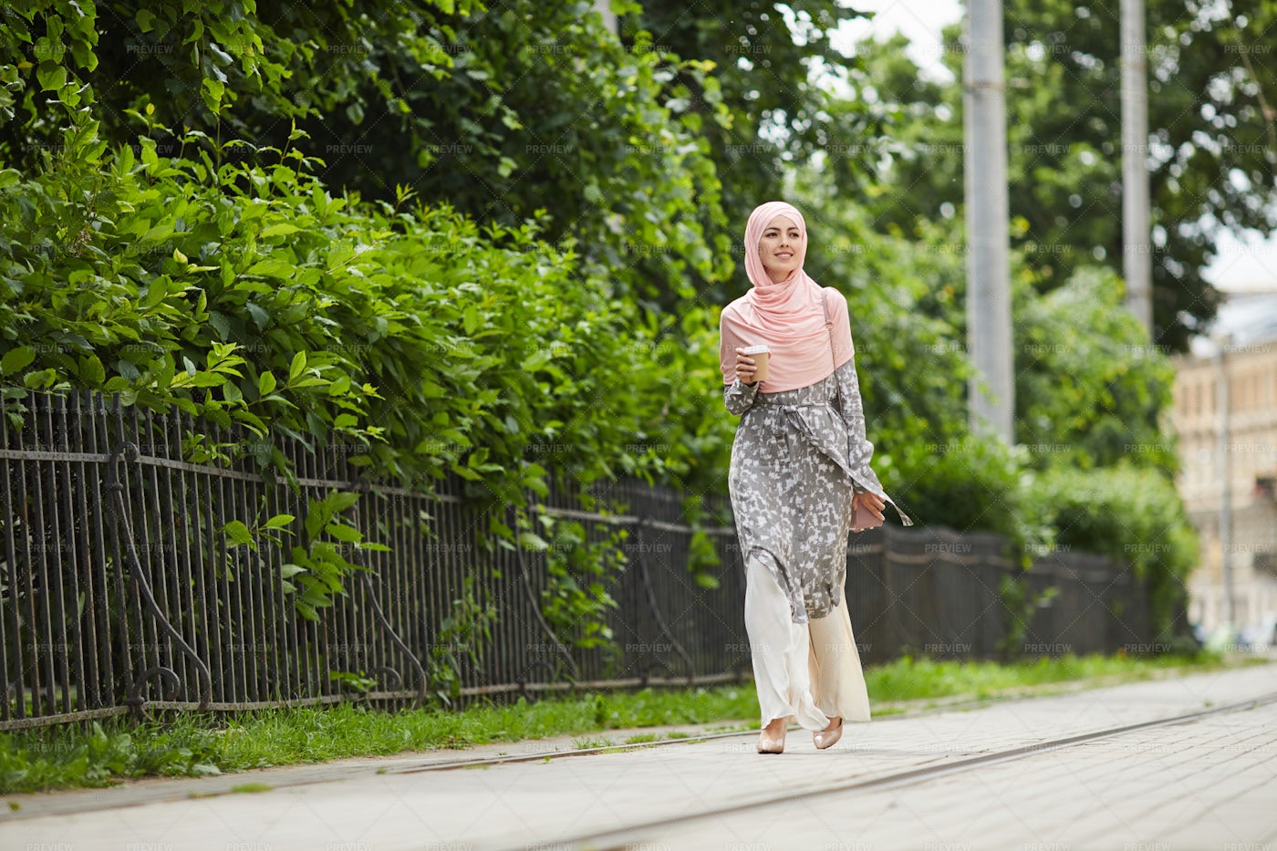 Stylish Muslim Woman Walking Over...: Stock Photos