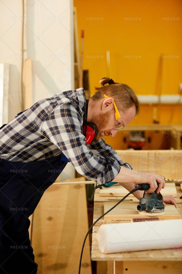 Contemporary Carpenter Polishing...: Stock Photos