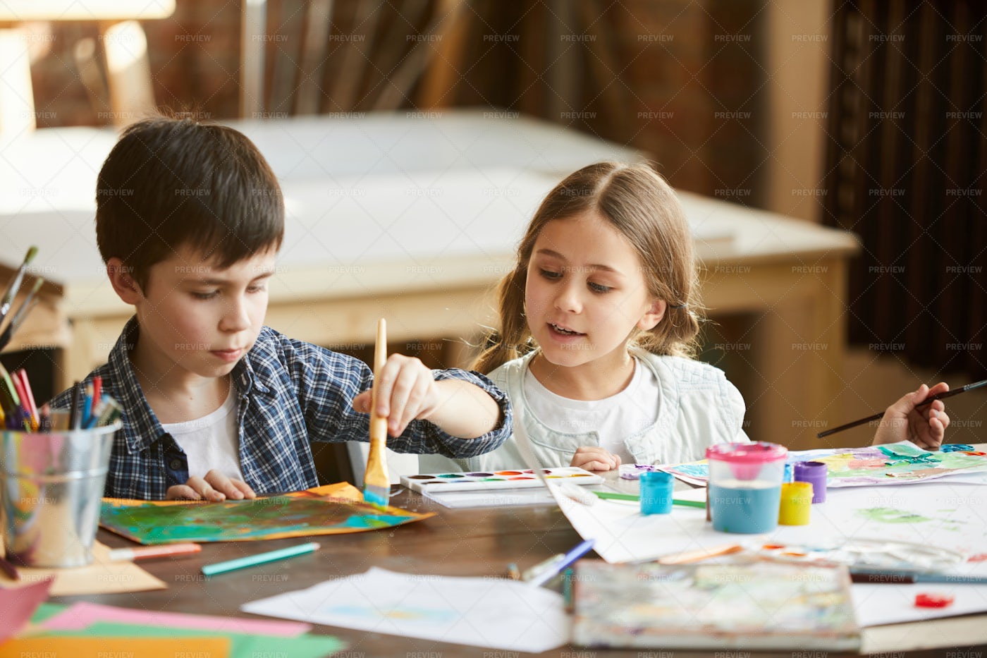 Two Kids Painting: Stock Photos
