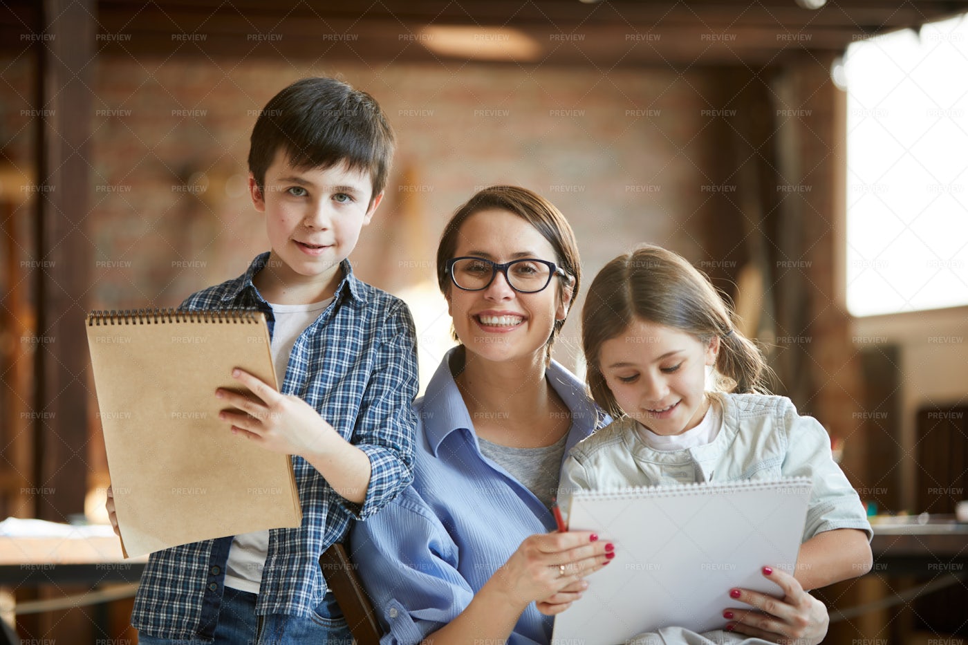 Mother Posing With Two Kids: Stock Photos