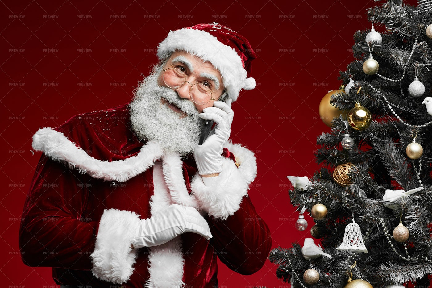 Santa Claus Speaking By Phone: Stock Photos