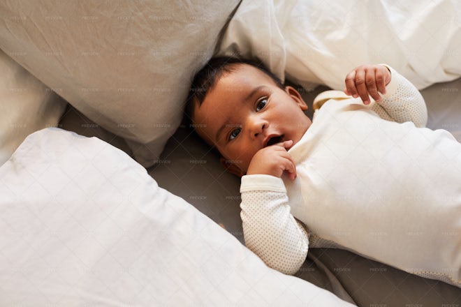 Cute Baby In White Baby Suit - Stock Photos | Motion Array