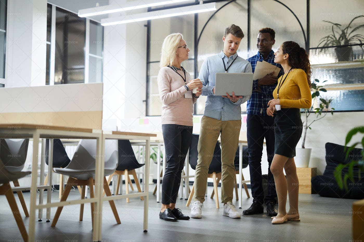 Colleagues Analyzing Online Data In...: Stock Photos