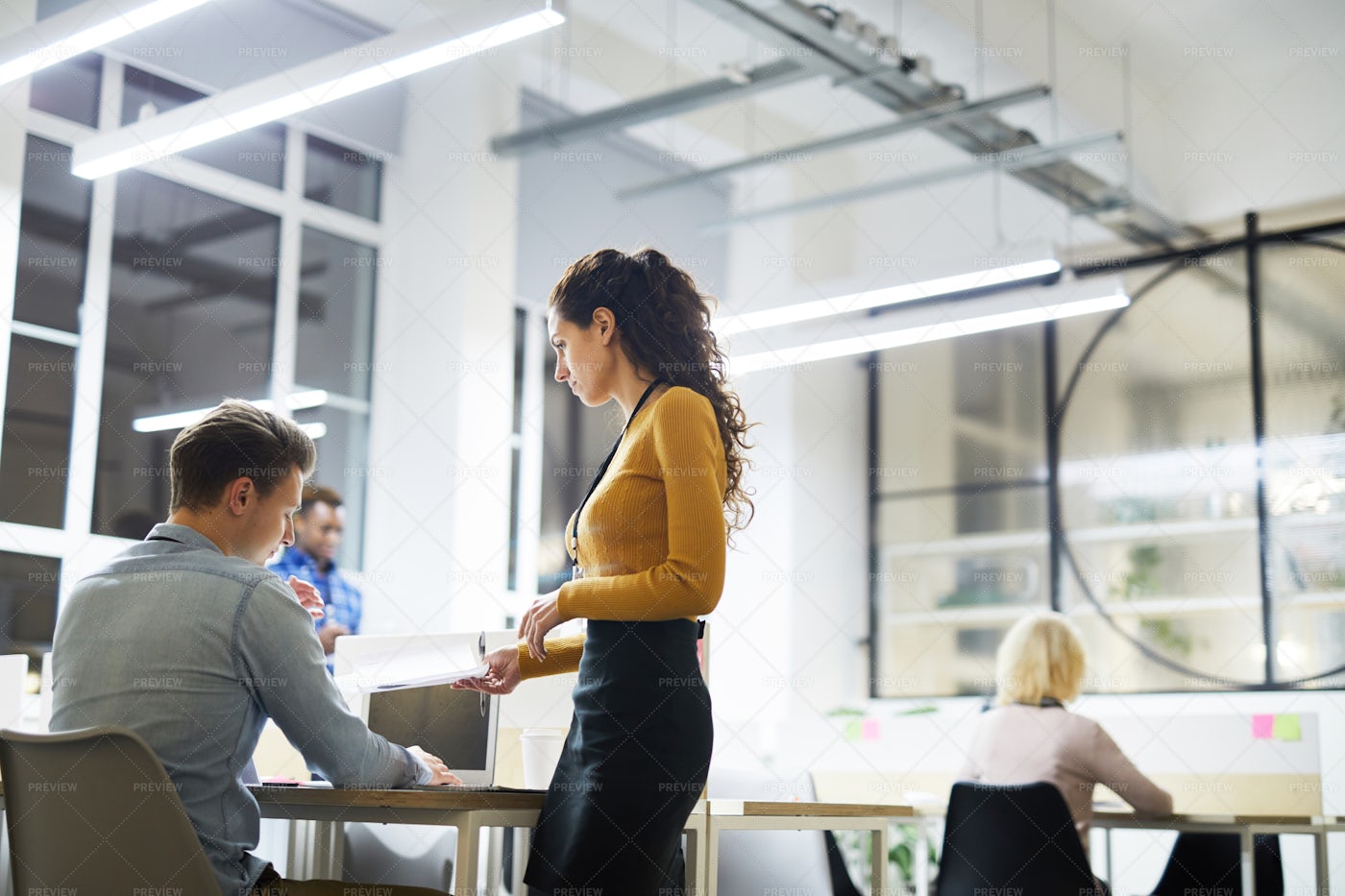 Lady Mentor Talking To Young Intern: Stock Photos