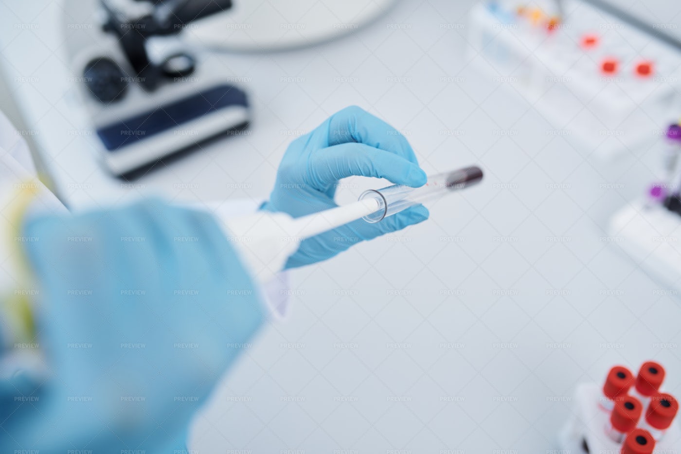 Performing Blood Test In Laboratory: Stock Photos