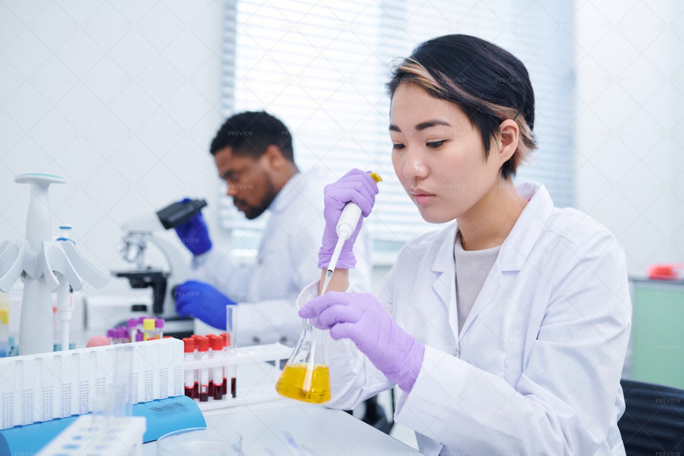 Lab Technician Testing Sample: Stock Photos