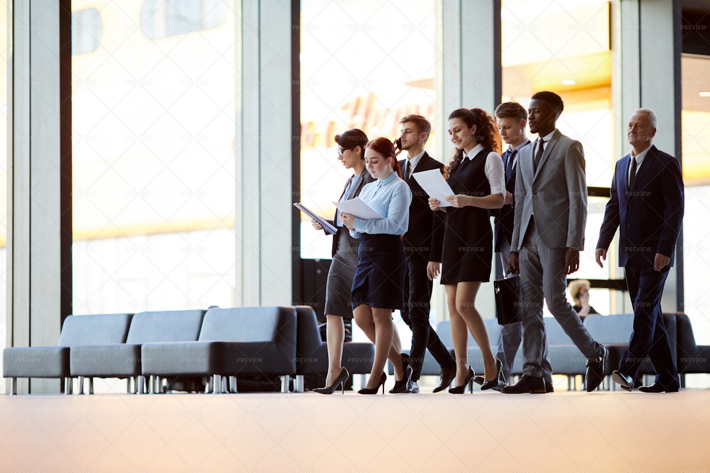 Office Workers Crossing Hall: Stock Photos