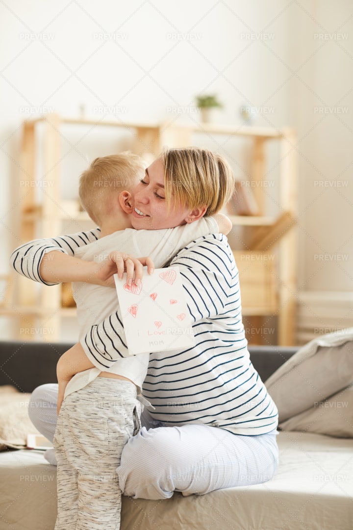 Giving Handmade Card To Mother: Stock Photos