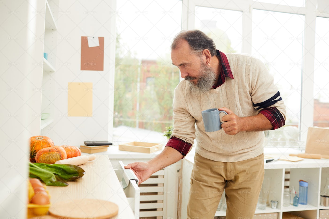 Senior Man Looking For Food In...: Stock Photos