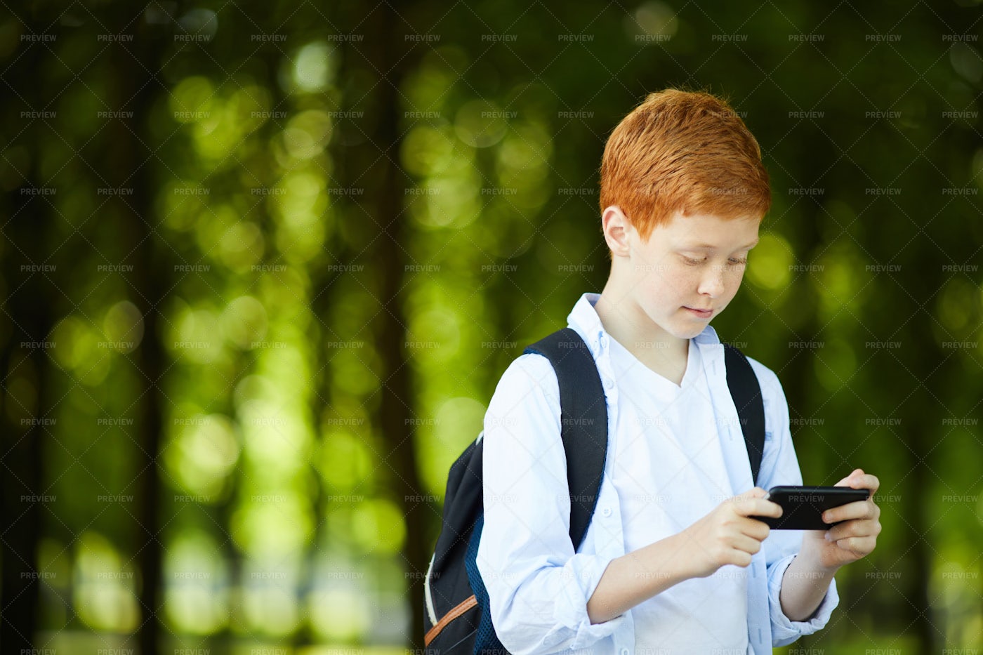 Smart school boy 9 фото Schoolboy Playing With Phone - Stock Photos Motion Array