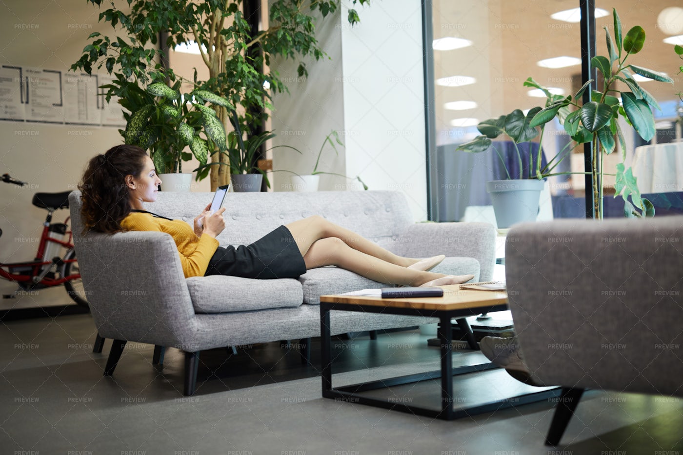 Relaxed Lady Reading Online Article...: Stock Photos