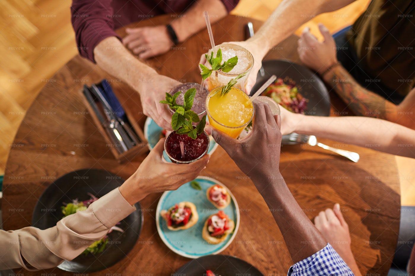 Friends Toasting With Drinks: Stock Photos