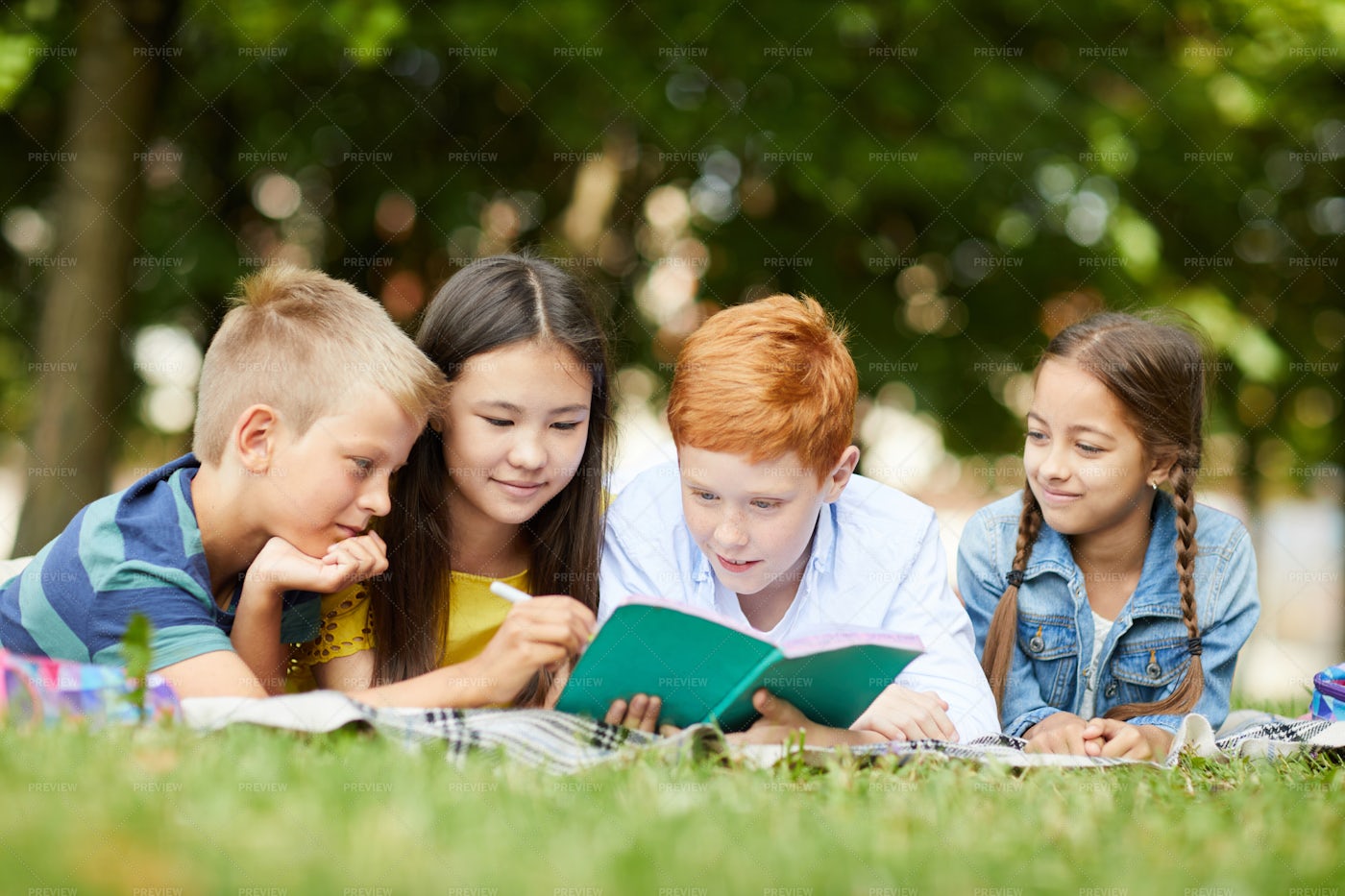 Studying Together In Park: Stock Photos