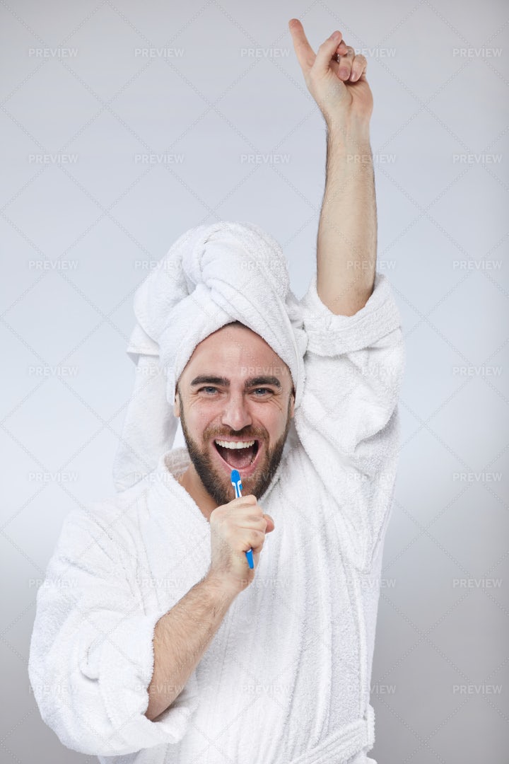 Funny Man Singing Into Toothbrush: Stock Photos