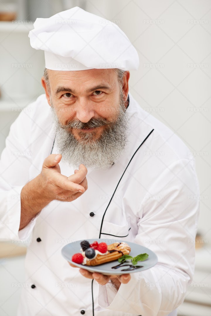 Senior Chef Presenting Dessert: Stock Photos