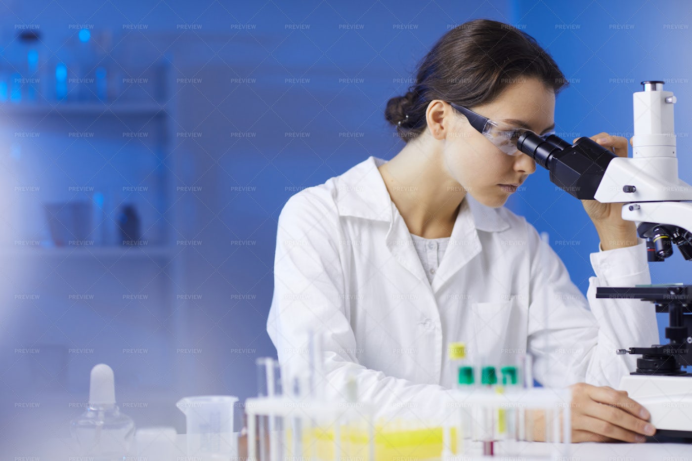 Female Technician Looking In...: Stock Photos