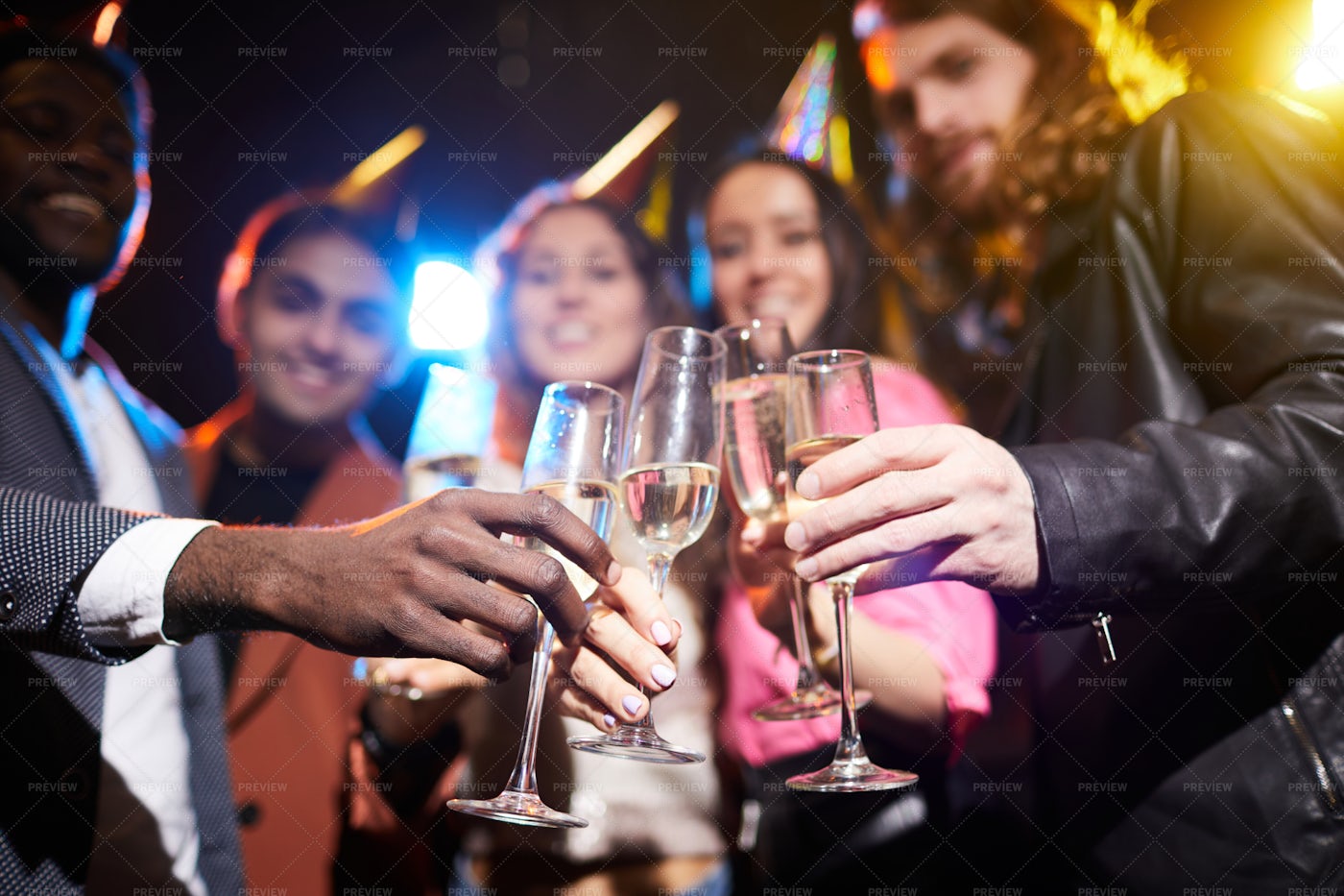 Full Champagne Flutes In Hands Of...: Stock Photos