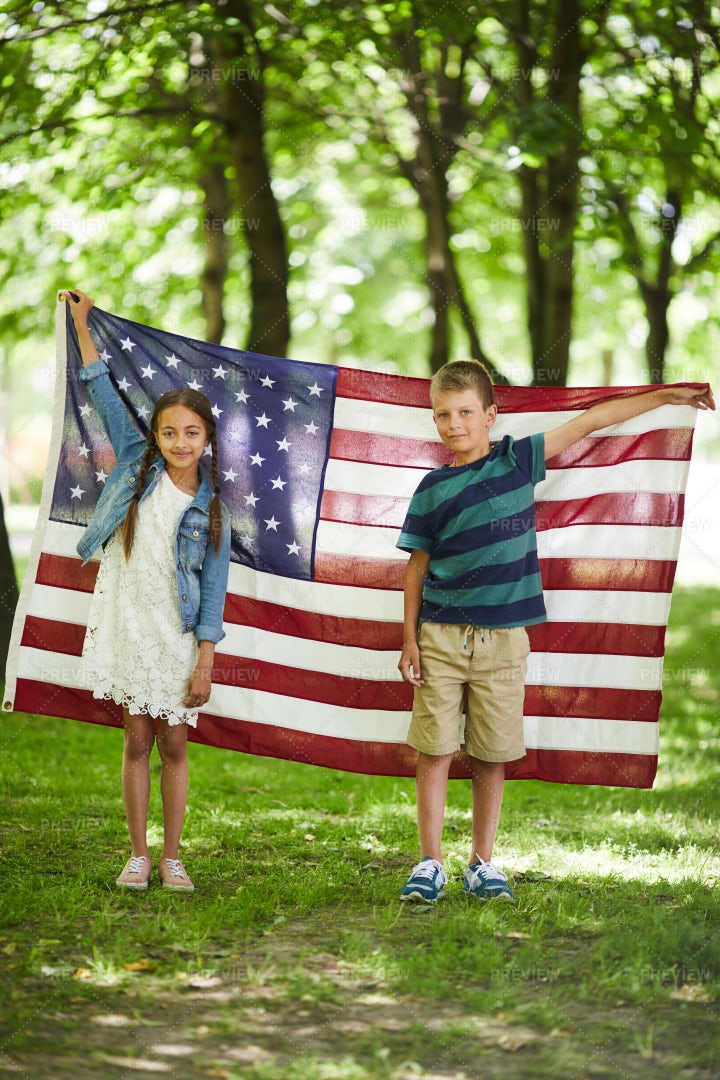 American Kids Holding National Flag: Stock Photos