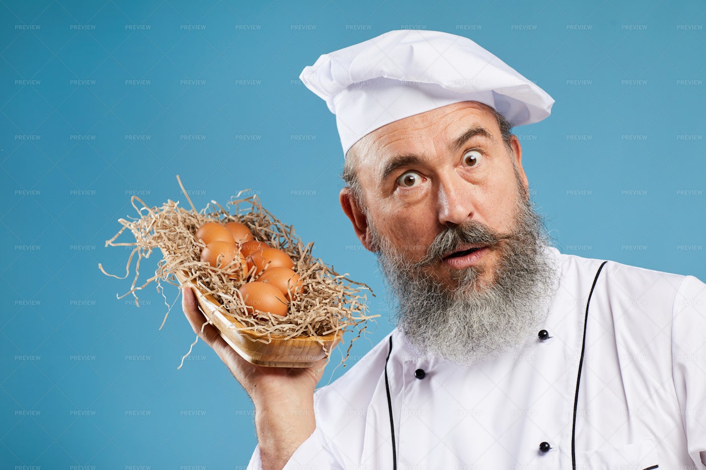 Bearded Chef Holding Eggs: Stock Photos