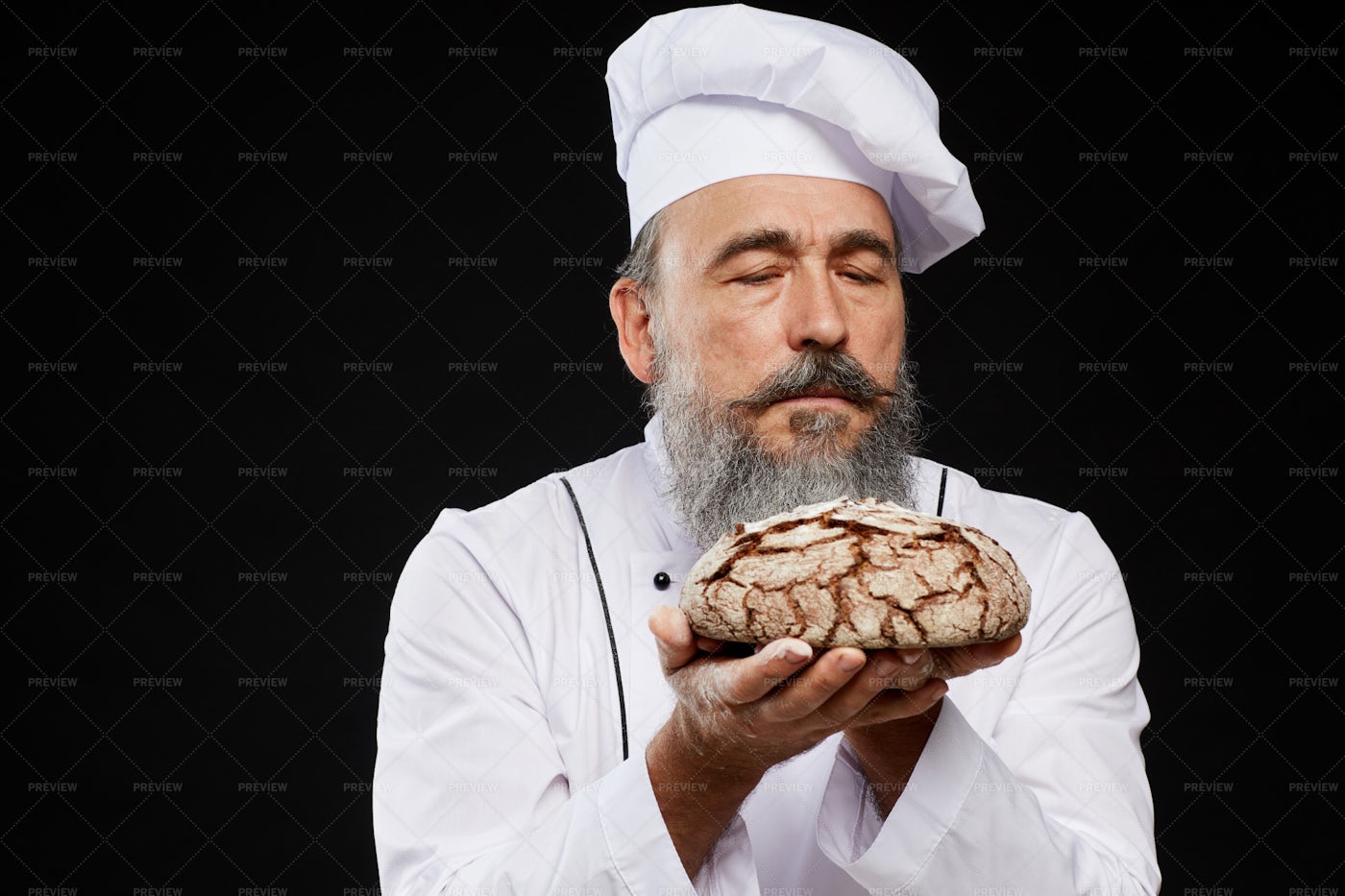 Bearded Baker Holding Fresh Bread: Stock Photos