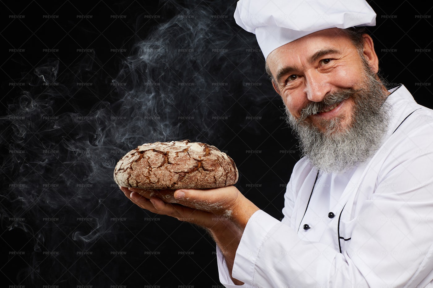 Smiling Baker Holding Fresh Bread...: Stock Photos