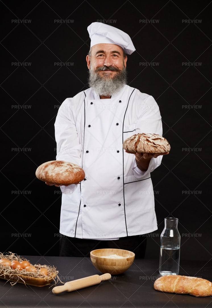 Smiling Baker Holding Traditional...: Stock Photos