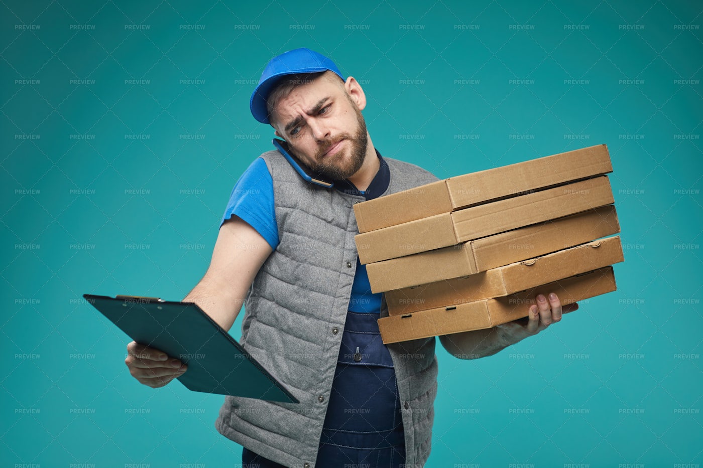 Pizza Guy Checking Order: Stock Photos