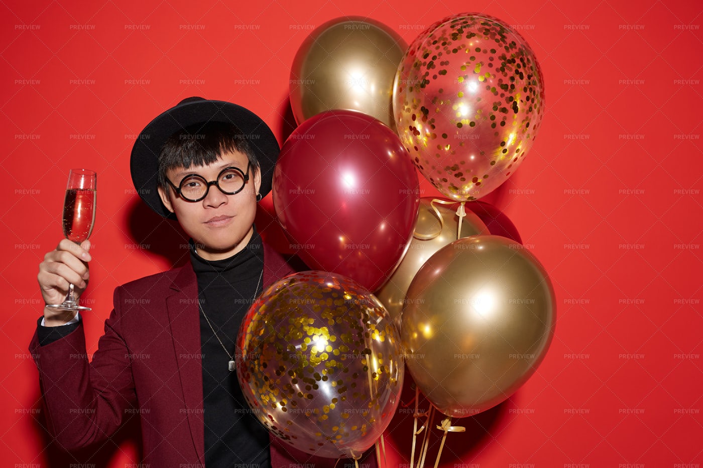 Party Shot Of Asian Man On Red: Stock Photos