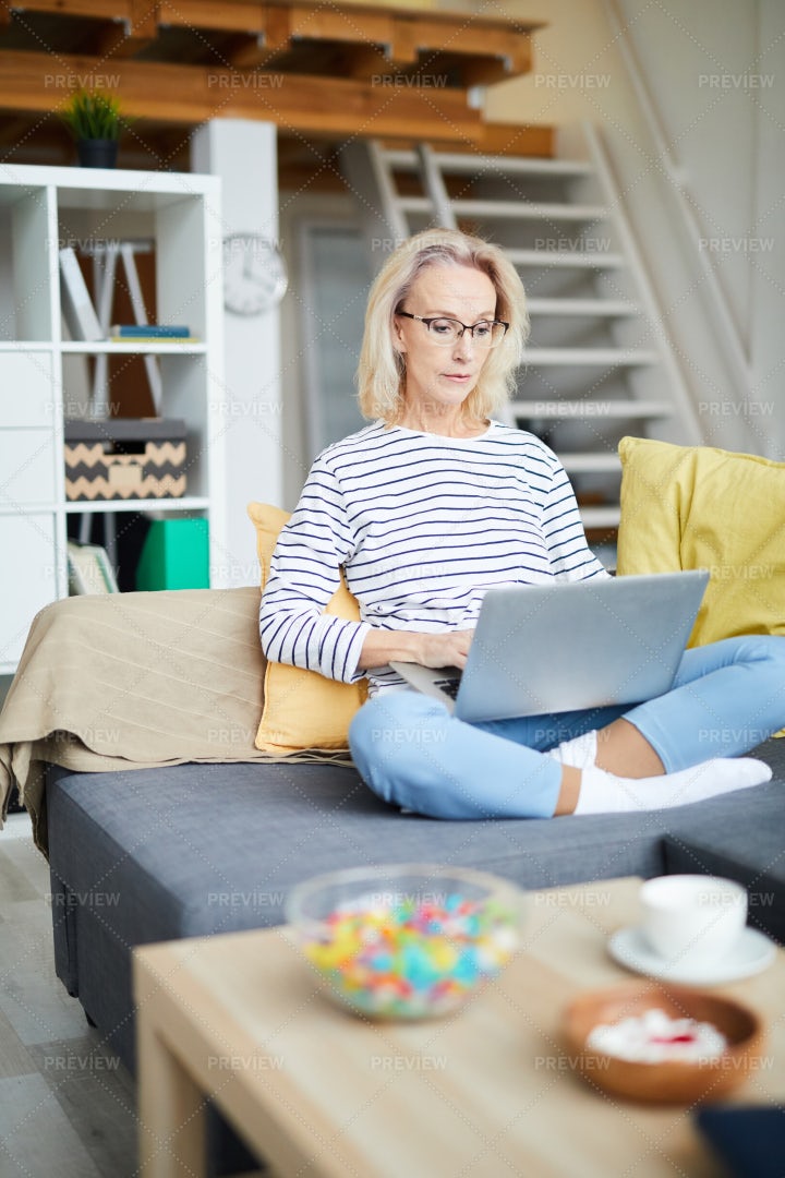 Contemporary Adult Woman Working At...: Stock Photos