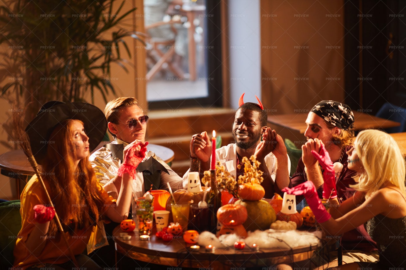Friends Dining At Halloween Party: Stock Photos