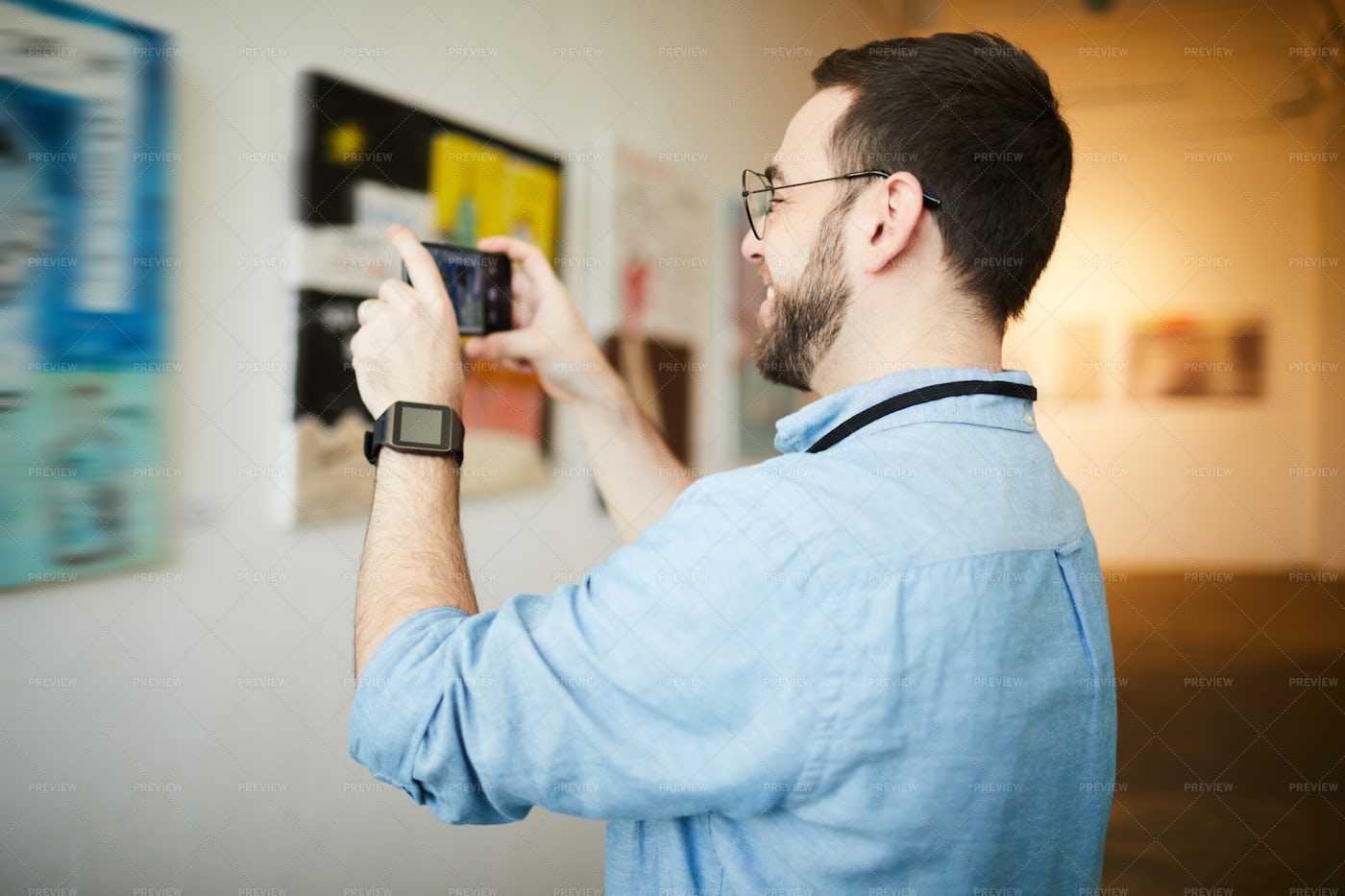 Museum Visitor Taking Photo Of...: Stock Photos