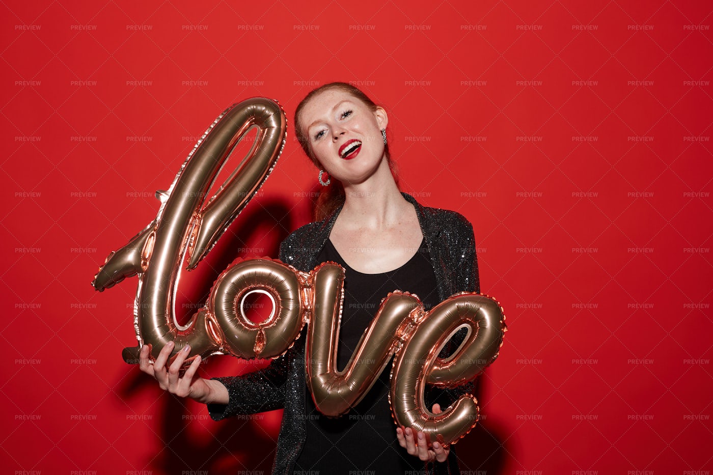 Single Woman Holding Love Balloon: Stock Photos