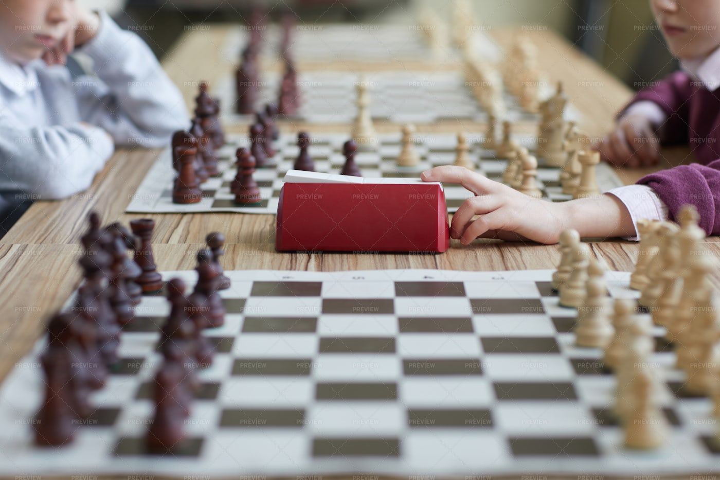 Girl Pressing Chess Clock: Stock Photos