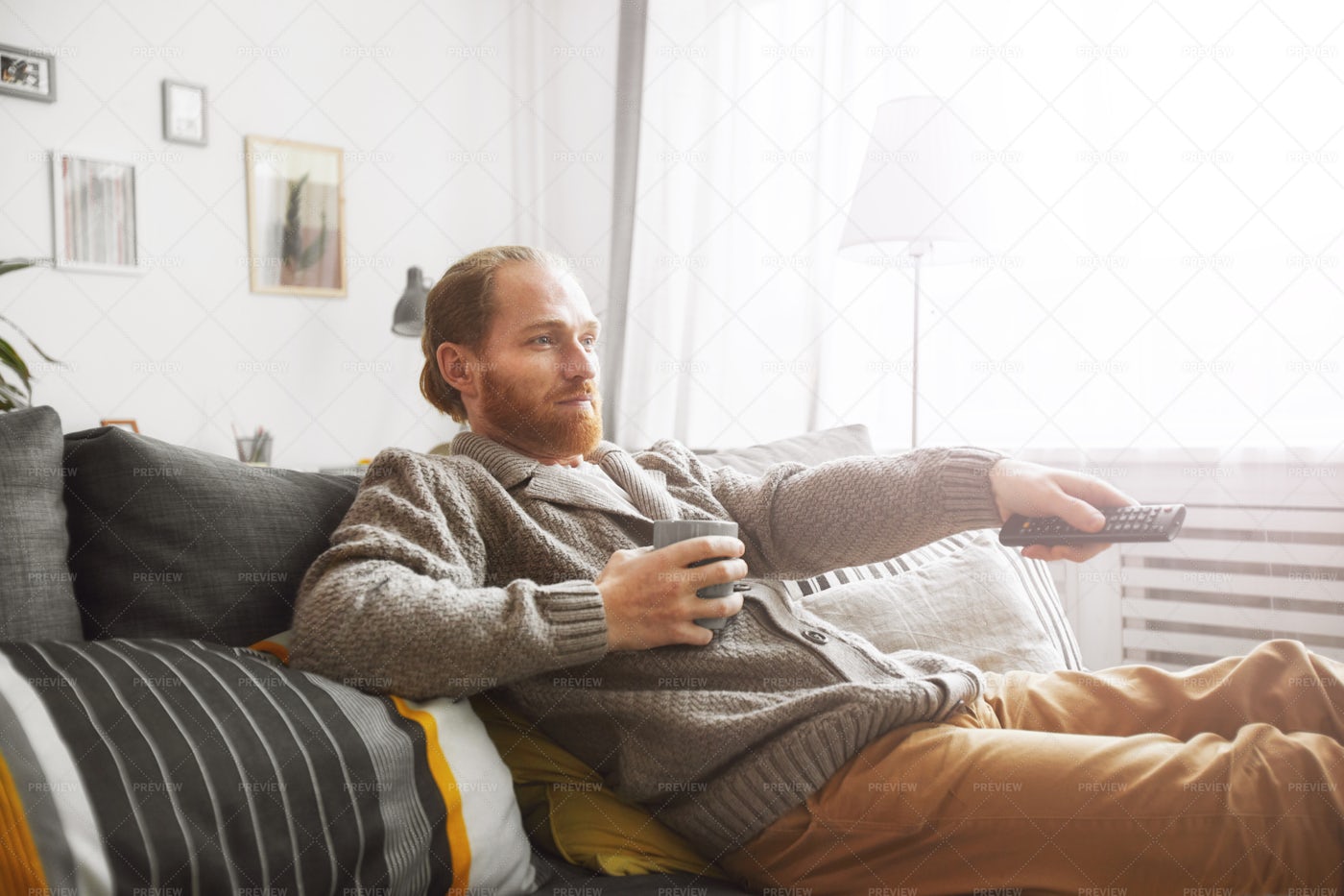 Man Relaxing At Home With TV: Stock Photos