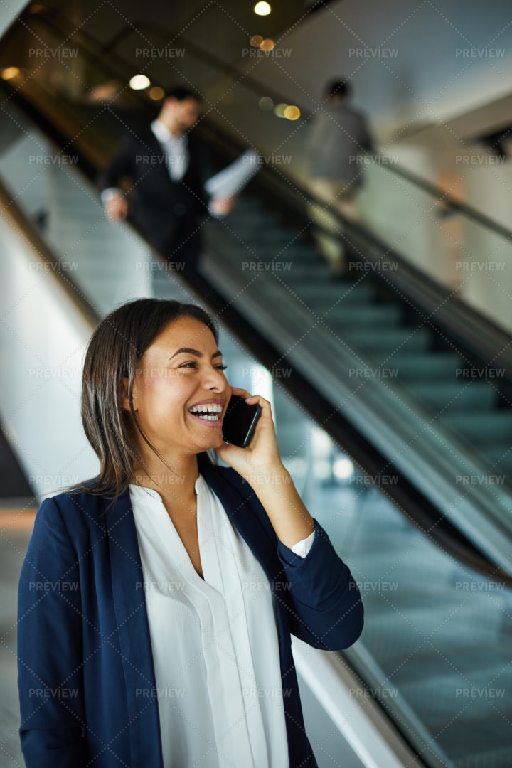 Excited Black Woman Laughing While...: Stock Photos