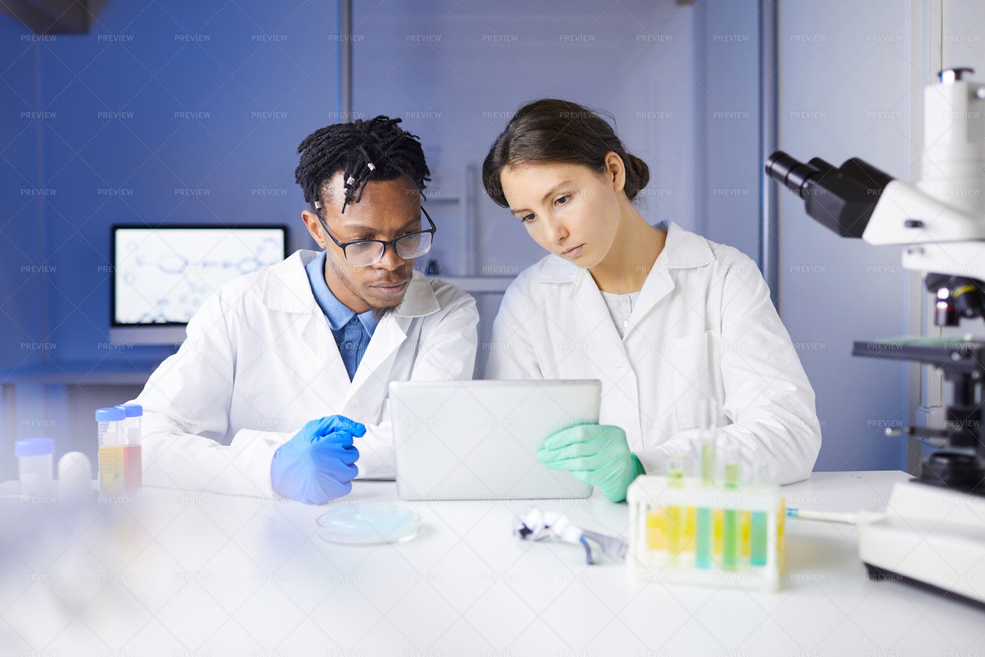 Team Of Young Scientists Working In...: Stock Photos