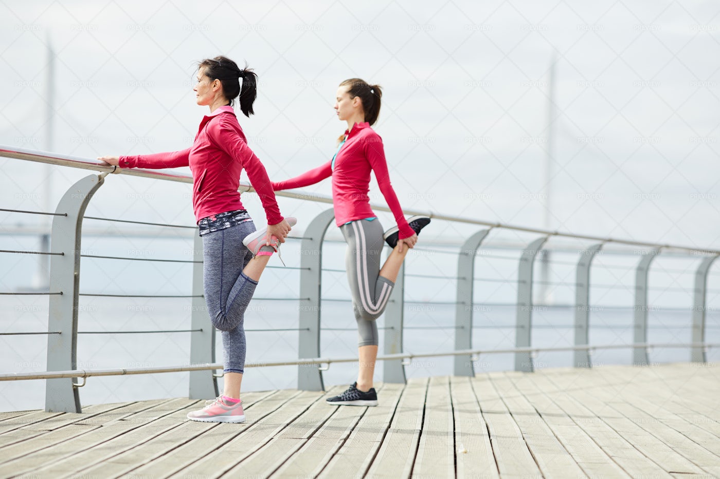 Women Stretching On Pier: Stock Photos