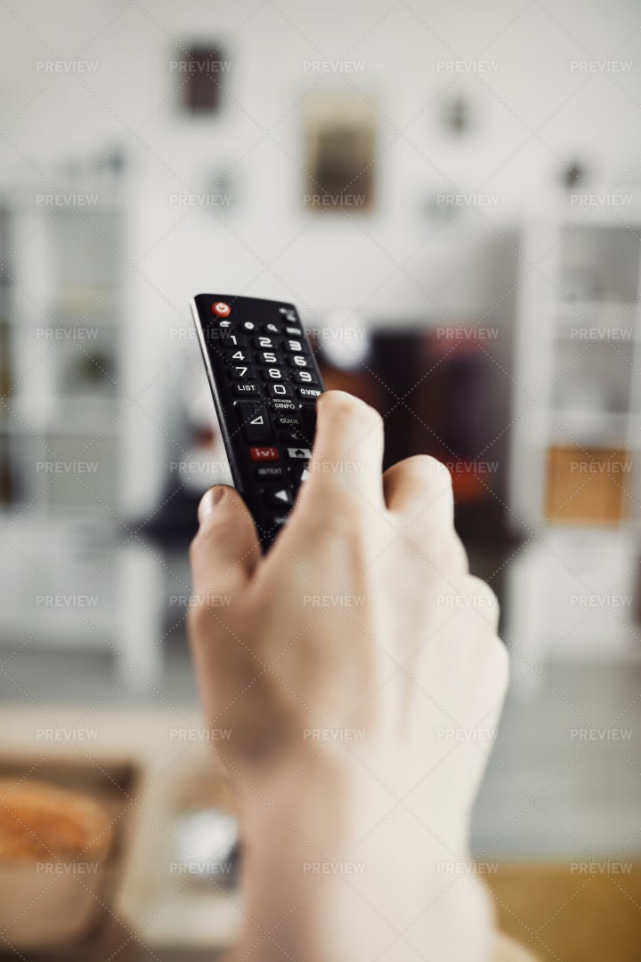 Closeup Hand Holding TV Remote: Stock Photos