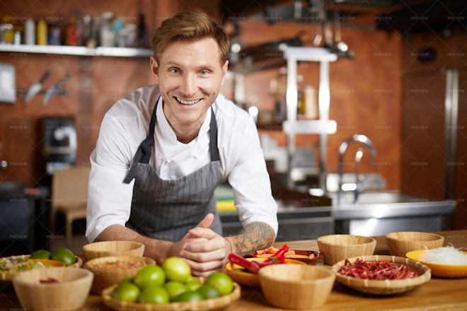 Portrait Of Smiling Chef In Kitchen - Stock Photos | Motion Array