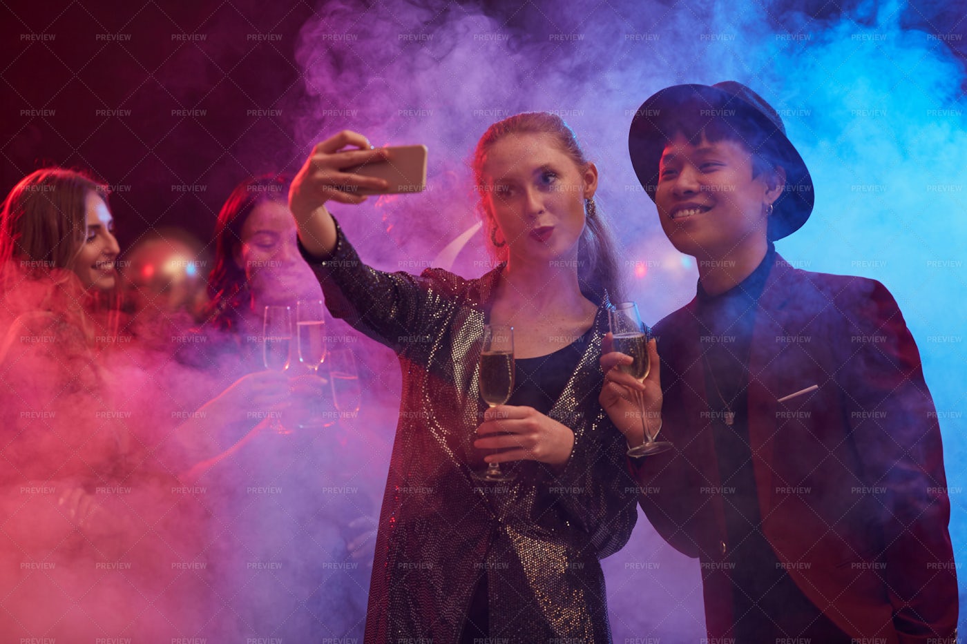 Couple Taking Selfie In Nightclub: Stock Photos