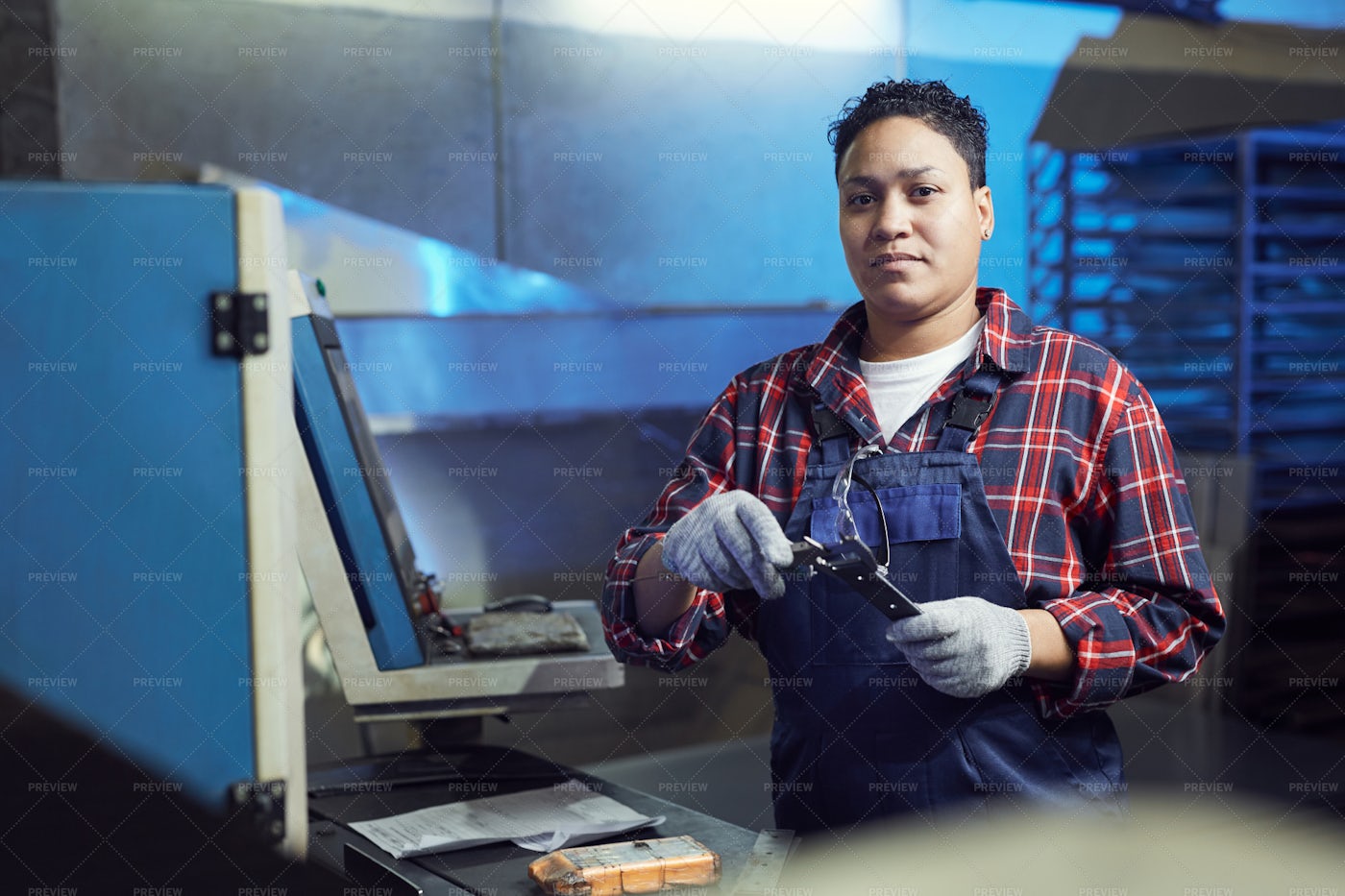 Female Worker Repairing Machines In...: Stock Photos