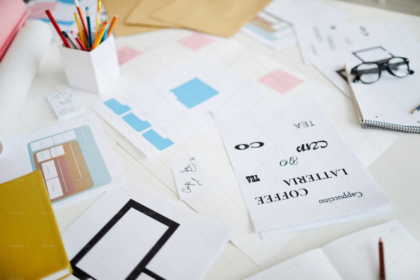 Scattered Designs On Desk: Stock Photos