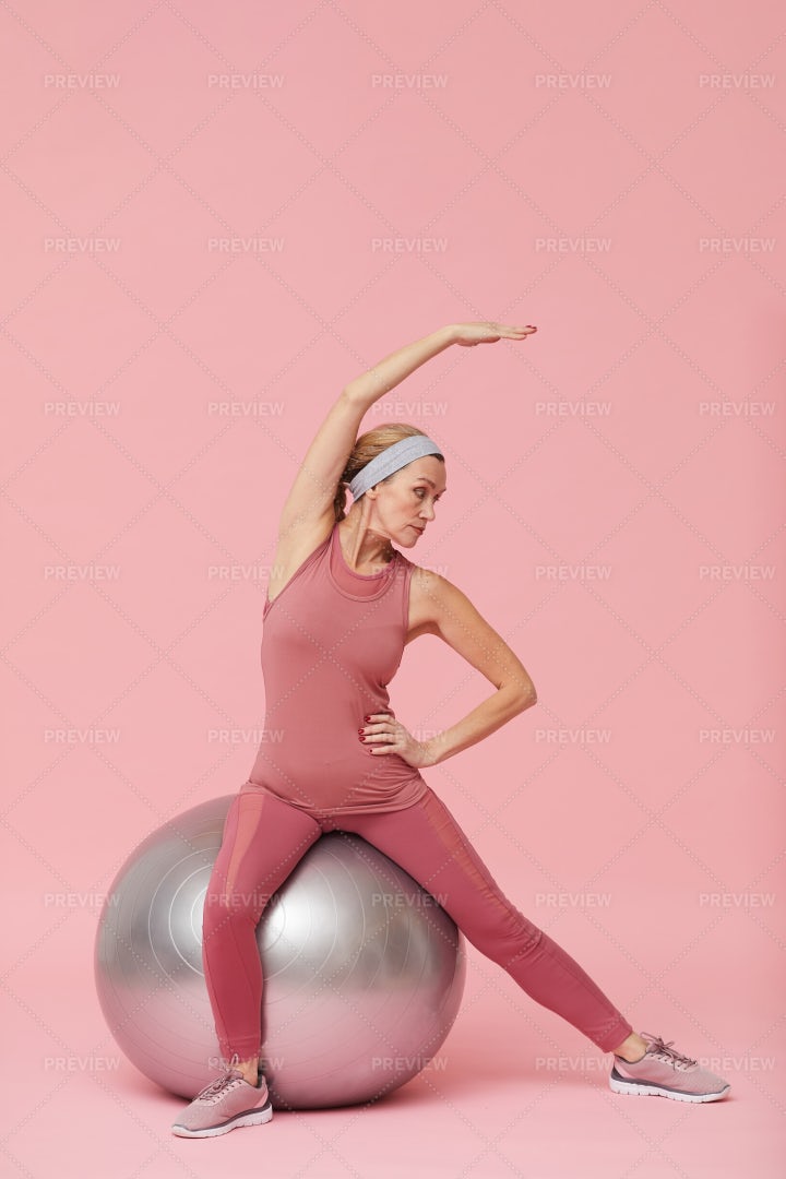 Active Mature Woman Stretching...: Stock Photos